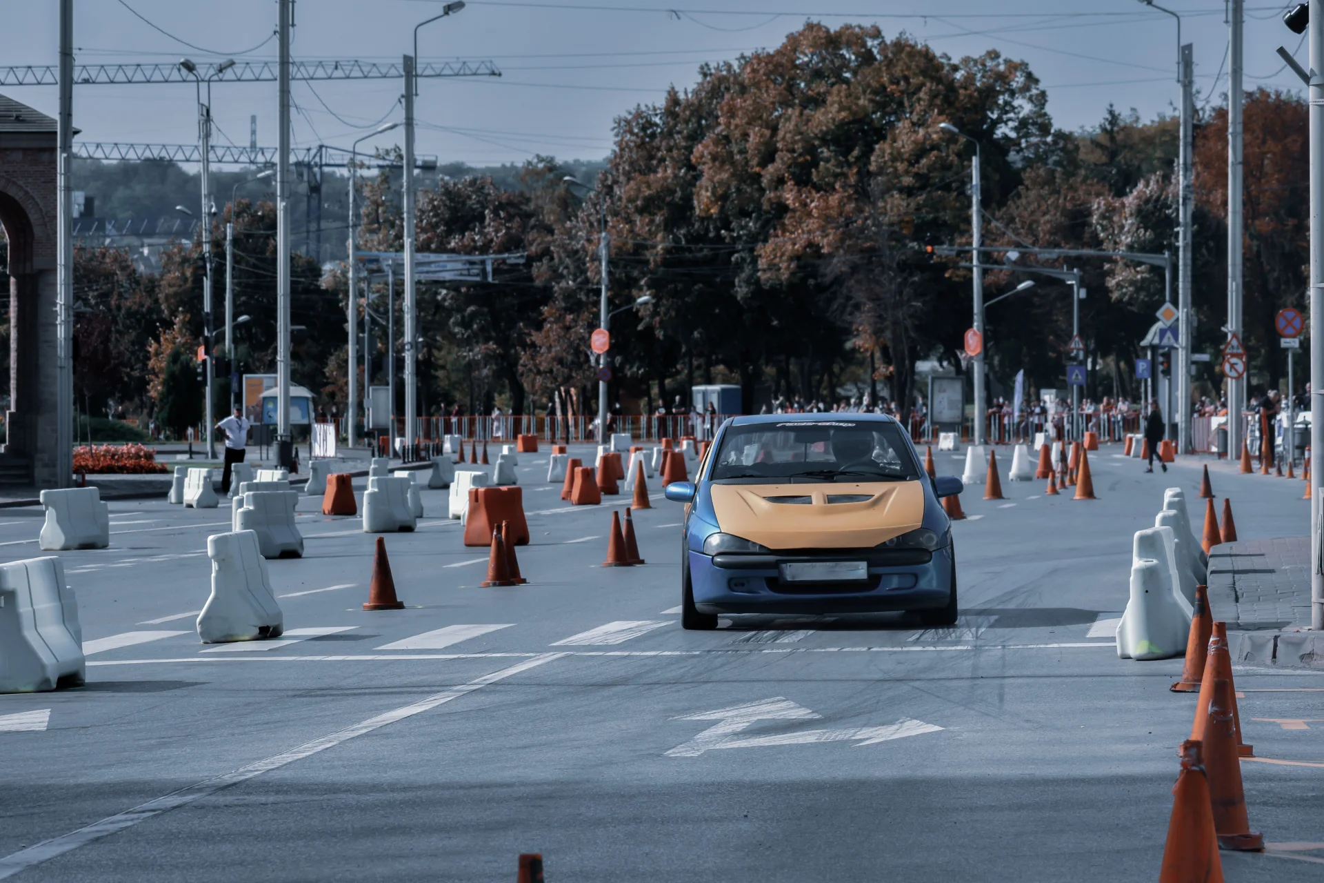 A driver in a car on a closed driving course